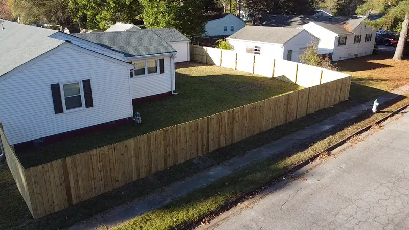 Aerial view of a new wood privacy fence around a backyard